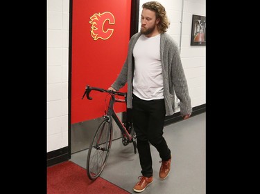 Calgary Flames goaltender Karri Ramo walks his bike down the hallway at the Scotiabank Saddledome as the team cleared out their lockers for the season on Monday, April 11, 2016.