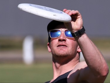 Rory Kamshank plays some frisbee with some buddies in Riley Park as the temperature hit record highs on Tuesday, April 19, 2016.