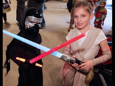 Star Wars fans Stephen Fox-Walker, 6 and Cecilia Hall, 6 warm up with their light sabres before the kids costume showcase during the Calgary Comic and Entertainment Expo  on Saturday, April 30, 2016.