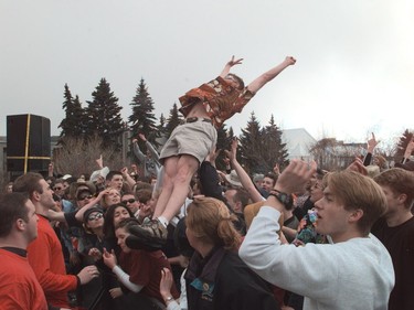 1998 - A student throws himself into the mosh pit  during a performance of The Travolta's,