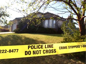 Calgary Police investigate at a home on Woodridge Close SW in Calgary, Alta on Wednesday April 27, 2016. Police were called around 3 a.m. to the home to respond to reports of a woman in medical distress. Officers found Melissa Couture, 38, of Calgary, unresponsive in the home and pronounced her dead.