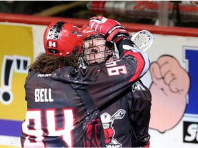 Calgary Roughnecks Curtis Dickson, right, celebrates his goal on Vancouver Stealth with teammate Tyson Bell during their game at the Scotiabank Saddledome in Calgary, Alta. on Saturday April 9, 2016. Leah Hennel/Postmedia