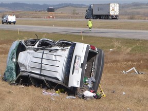 Two adults are dead and five others have suffered serious injuries after this van lost control and rolled several times on Highway 1, west of Calgary. David Feil/Cochrane Times Photo