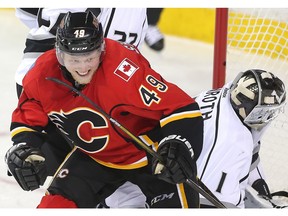 Hunter Shinkaruk of the Calgary Flames pumps his fist after scoring on Los Angeles Kings goalie Jhonas Enroth for his first goal at the Saddledome during the second period Tuesday April 5, 2016.