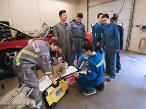 Saint Francis High School students unload new tools in their automotive class on April 28, 2016. The 78 member dealers of the Calgary Motor Dealers Association provided $100,000 for the purchase of tools and supplies for 13 public and separate high schools. GAVIN YOUNG/POSTMEDIA