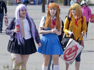 From the left,  Sawyer Williams, Helena Jakobs and Aster Wilson makes their way to the BMO Centre as the doors open on this year's Calgary Comic and Entertainment Expo Thursday April 28, 2016.