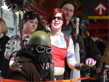 Scott and Charlene Bayfield, left, and Rebecca and Rob Jackson, as the New California Republic Rangers from the video game Fallout, wait in line as the doors open on this year's Calgary Comic and Entertainment Expo at the BMO Centre Thursday April 28, 2016.