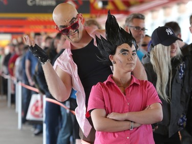 Brett Lewis and Stefanie Bowie, as Nappa and Regina from the anime series Dragon Ball Z, wait in line as the doors open on this year's Calgary Comic and Entertainment Expo at the BMO Centre Thursday, April 28, 2016.