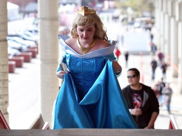 Kristi Osterreicher as Aurora from Sleeping Beauty, walks up the steps to the lineup as the doors open on this year's Calgary Comic and Entertainment Expo at the BMO Centre Thursday, April 28, 2016.