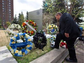 The City of Calgary Workers Memorial was surrounded by hard hats as wreaths are laid for a memorial ceremony for the International Day of Mourning for Workers killed or injured on the job on Thursday.