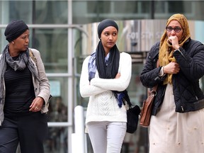 Naima Ismail, right, mother of murder victim Natasha Farah, leaves the Calgary Court Centre her daughter, Natasha's sister, Narura, and her aunt Asha Haji, left, after Hussein Ibrahim was sentenced to 9 years for manslaughter in connection with her death Friday April 29, 2016. (Ted Rhodes/Postmedia)