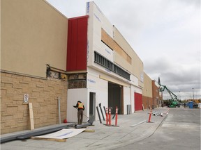Construction workers renovate the former Target location in Signal Hill to become a new Lowes location.