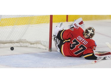 Calgary Flames goalie Joni Ortio crumbles to the ice after being scored on by the Los Angeles Kings in overtime at the Saddledome Tuesday April 5, 2016.