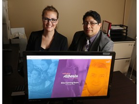 Kali Readwin and Milton Ortega, provincial manager with (aaisa) the Alberta Association of Immigrant Serving Agencies, were photographed with a splash page from the soon to be launched RefugeeAlberta.ca website on Wednesday, April 13, 2016. The website will be a one-stop shop for all refugee-related matters in the province.