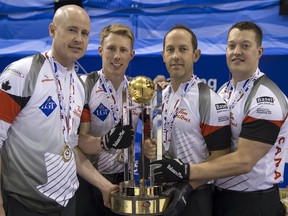 Canada's skip Kevin Koe, with Marc Kennedy, Brent Laing and Ben Hebert, from left, celebrate after winning the World Men's Curling Championship in Basel, Switzerland, on April 10, 2016.