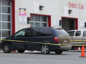 Calgary police watch over the blue minivan that was taken on a stolen vehicle pursuit that lasted for hours and took them on a wild goose chase all over the city. The suspect was nabbed at 76 Street at 112 Avenue NW Tuesday April 12, 2016.