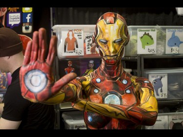 Entrepreneur and self-body-painting genius Kay Pike works her Cosplay Canada booth as Ironman (it took 16 hours for her to paint this on herself) during the Calgary Comic and Entertainment Expo at Stampede Park in Calgary, Alta., on Saturday, April 30, 2016. Lyle Aspinall/Postmedia Network