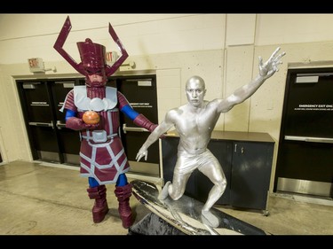 Galactus (Matt Glanfield) and the Silver Surfer (Kyle Pottie) strike a pose during the Calgary Comic and Entertainment Expo at Stampede Park in Calgary, Alta., on Saturday, April 30, 2016. Lyle Aspinall/Postmedia Network