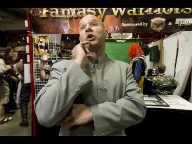 Dr. Evil, aka Steve Zmijak, strikes a pose during the Calgary Comic and Entertainment Expo at Stampede Park in Calgary, Alta., on Saturday, April 30, 2016. Lyle Aspinall/Postmedia Network