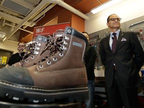 Joe Ceci, Alberta Minister of Finance & President of the Treasury Board, displayed his 2016 budget boots in Edmonton on April 13, 2016.