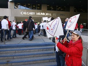 Chinatown development protesters gather at city hall to show their resistance to proposed developments in the neighbourhood in Calgary on Monday, April 11, 2016.
