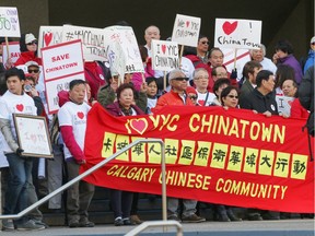 Chinatown development protesters gather at city hall to show their resistance to proposed developments in the neighbourhood in Calgary on Monday, April 11, 2016.