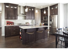 The kitchen in the Hathaway show home by Excel Homes in Savanna in Saddle Ridge.