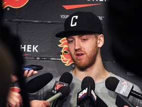 The Calgary Flames' Dougie Hamilton speaks with the media at the Scotiabank Saddledome as the team cleared out their lockers for the season on Monday, April 11, 2016.
