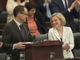 Finance Minister Joe Ceci and Premier Rachel Notley share a light moment during the reading of the budget Thursday.