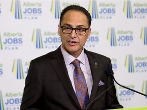 President of Treasury Board and Minister of Finance, Joe Ceci, speaks to the media before the budget is delivered in the Alberta Legislature on April 14