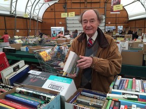 FILE PHOTO: Gerry Morgan talks about some of the finds at the 14th annual Servants Anonymous Book Sale.