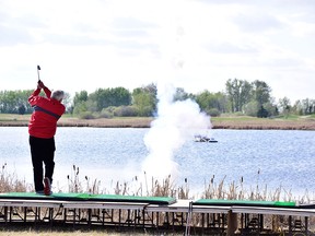 Organizers set off pyrotechnics as a stunt in a golf ball as part of Erwin Braun, manager of the Western Irrigation District's shot at the Jim and Audrey Put a Kid on a Course Fundraiser at the Strathmore Golf Course on April 27, 2016.