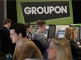 Workers work on projects at Groupon's international headquarters on June 10, 2011 in Chicago, Illinois. With a recent funding boost, expect to  see more from the popular site.
