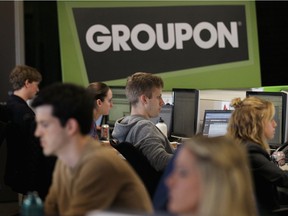 Workers work on projects at Groupon's international headquarters on June 10, 2011 in Chicago, Illinois. With a recent funding boost, expect to  see more from the popular site.