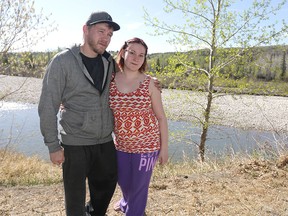 Levon Mackillop and Jasmine Van Dyk pose along the river pathway in northwest Calgary, Alta on Tuesday, April 19, 2016.