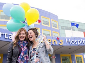 Jaclyn Olsen (right) celebrated her 32 birthday by performing 32 random acts of kindness in Calgary, Alta., on Friday, April 29, 2016. One of those acts was handing out balloons to kids at the Alberta Children's Hospital alongside best friend, Jessica Lesway. This is the third time Olsen has celebrated her birthday by doing random acts of kindness.