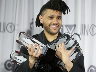 The Weeknd holds his five Juno awards during the 2016 JUNO Awards in Calgary, Alta., on Sunday, April 3, 2016.