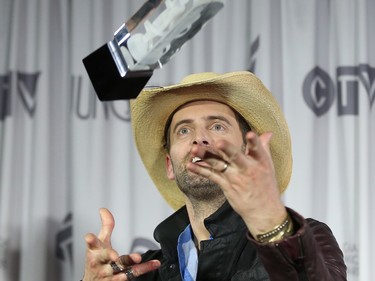 Dean Brody poses with Juno after winning the Country Album of the Year at the 2016 JUNO Awards in Calgary, Alta., on Sunday, April 3, 2016. AL CHAREST/POSTMEDIA