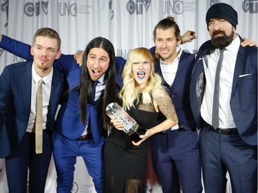 Canadian alternative rock band, Walk Off The Earth pose with their Juno after winning the Group of the Year at the 2016 JUNO Awards in Calgary, Alta., on Sunday, April 3, 2016. AL CHAREST/POSTMEDIA