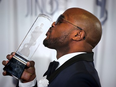 Kafinal kiss his trophy after winning Reggae Recording of the Year during the 2016 JUNO Gala Dinner & Awards in Calgary, Alta., on Saturday, April 2, 2016.