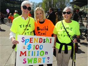 (L-R) Christine Spenceley, Linda Nudd and Margaret Jensen join other supporters who gathered at a rally at City Hall in Calgary, Alta on Wednesday April 20, 2016 to voice their concerns about a bus rapid transit (BRT) line planned for southwest Calgary. Jim Wells//Postmedia