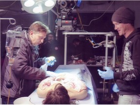 Leo Wieser and crew member Josiah Buhler on the set of Wynonna Earp preparing for a scene involving mechanical special effects and prosthetics created by Alyssa Moor.