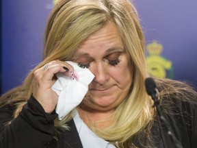 Lisa Freihaut wipes away tears during a news conference seeking information to the murder of her mother, Irene Carter, in Lethbridge on April. 7. Freihaut has been charged with second-degree murder in the death of her mother.