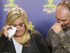 Lisa Freihaut, daughter of homicide victim Irene Carter, stands beside her husband Dean Freihaut as she speaks to media at the Calgary Police Service headquarters in Calgary, Alta., on Thursday, April 7, 2016.