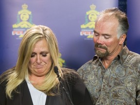 Lisa Freihaut, daughter of murder victim Irene Carter, stands beside her husband Dean Freihaut as she speaks to media at the Calgary Police Service headquarters in Calgary, Alta., on Thursday, April 7, 2016. Carter, age 78, was found stabbed to death in her Lethbridge home in January. Lyle Aspinall/Postmedia Network