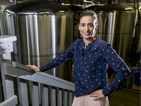 Manjit Minhas of Minhas Micro Brewery stands for a photo inside her company's brew room in Calgary, Alta., on Thursday, April 7, 2016.