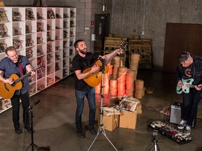 Michael Bernard Fitzgerald (centre) alongside Matty McKay (left) and Russell Broom (right) played a single off his album, "I wanna make it with you," at the Calgary Herald on Wednesday, April 20, 2016.