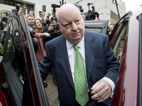 Senator Mike Duffy leaves an Ottawa courthouse Thursday after being cleared of all charges.