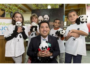 Minister of Culture and Tourism Ricardo Miranda is flanked by Grade 2 students (L-R) Sophia Mahallati, Marlo Quinn, Makan Vakili and Saloman Giraldo of Elboya Elementary School during a media opportunity inside the Eurasia Gateway enclosure at the Calgary Zoo in Calgary, Alta., on Thursday, April 28, 2016. The zoo was celebrating the announcement that the provincial government would contribute $10M to the upcoming panda-exhibit preparation, which will convert the Eurasia Gateway, a former elephant home, into a lush jungle.
