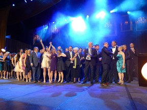 Morrison Homes celebrates on stage after winning the CHBA-Calgary Region  2014 Grand SAM Award for Builder of the Year, on April 18, 2015, at the Telus Convention Centre.